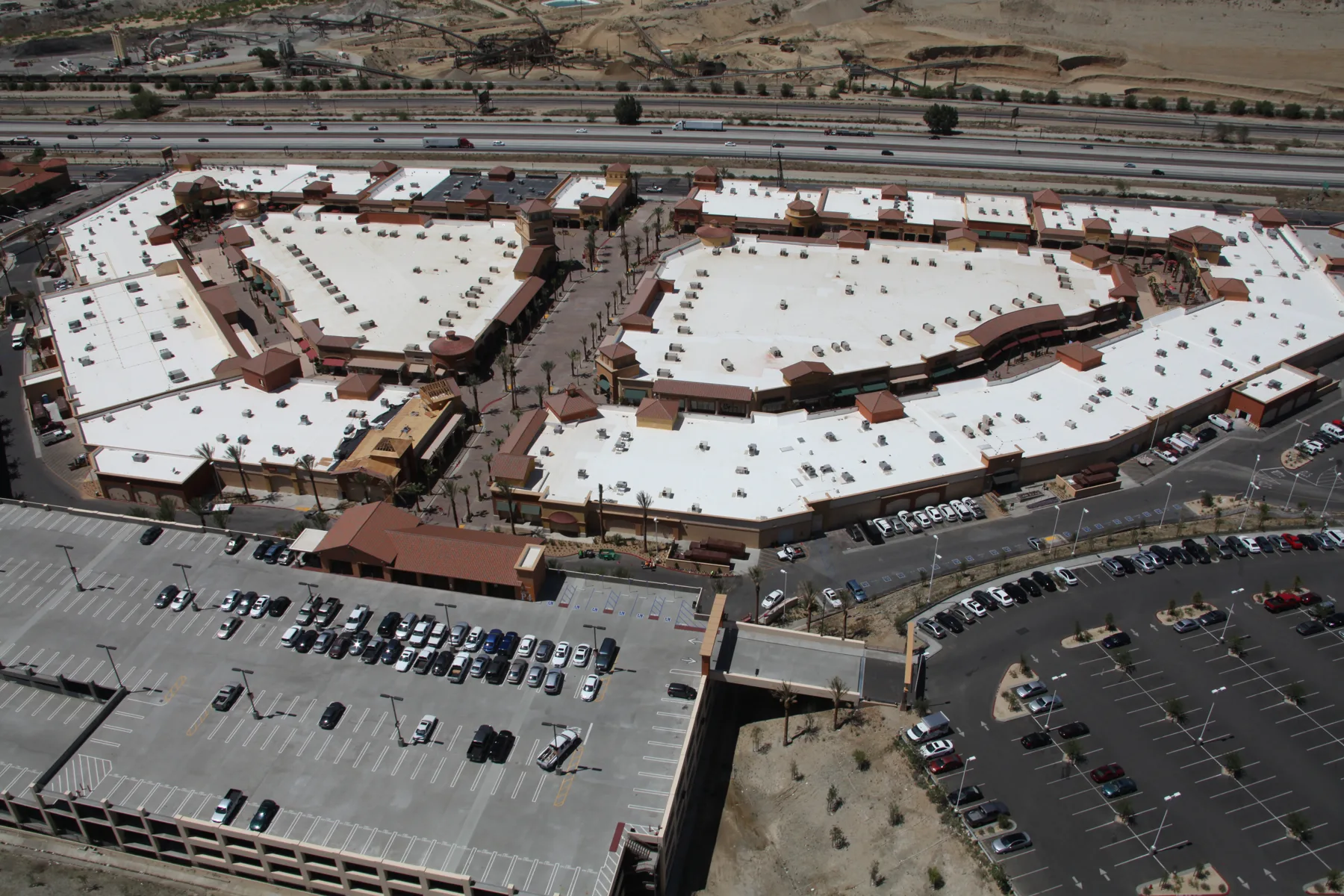Aerial view of the Desert Hills Premium Outlets buildings, roads, and parking areas.
